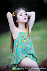 Girl sitting on stone wearing teal and yellow pineapple monogrammed tank dress 0yMpa0
