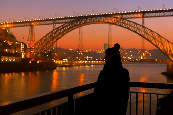 Female walking on embankment during sundown