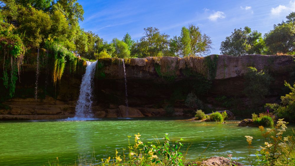 View of beautiful waterfall and lake