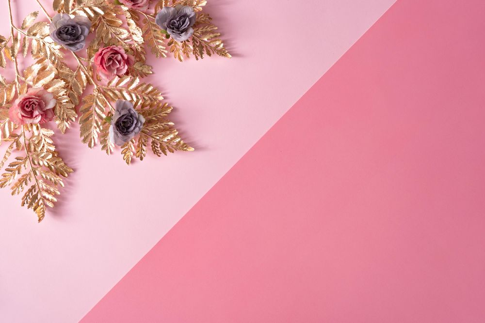 Layout made with pastel pink and purple flowers and gold leaves