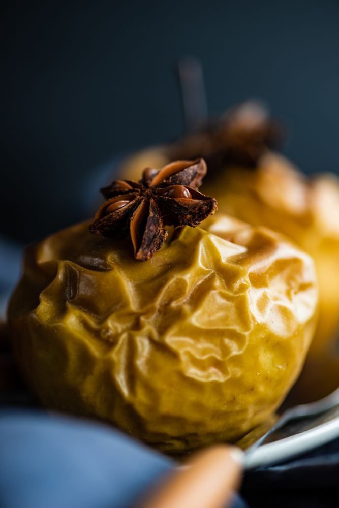 Close up of baked apple topped with star anise