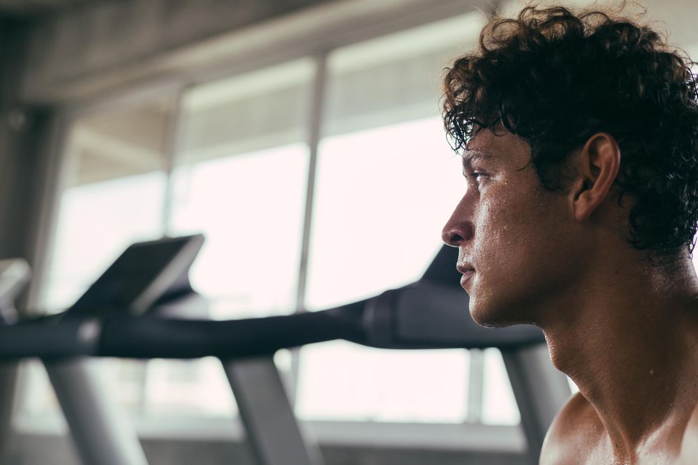 Side view of man sweaty after a workout