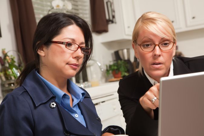 Businesswomen Working Together on the Laptop