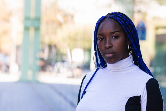 Thoughtful Black woman on street
