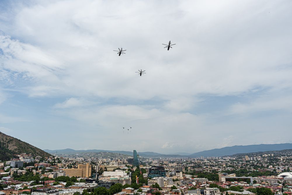 Helicopters fly in the sky of Tbilisi city