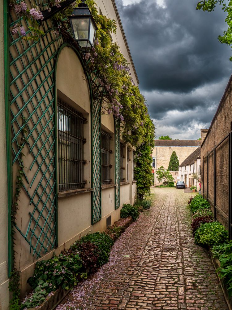 Empty streets of the medieval city of Beaune in Burgundy. The stormy sky