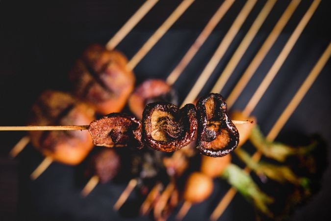 Mushroom skewer over tasty grilled skewers in cafe