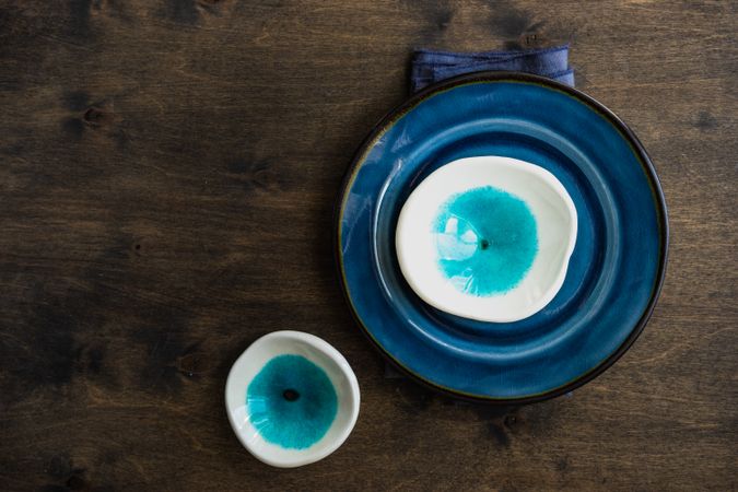 Empty blue bowls on wooden background
