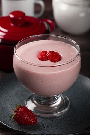 Delicious strawberry mousse in glass goblet.