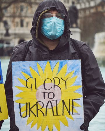 London, England, United Kingdom - March 5 2022: Man with “Glory to Ukraine” sign