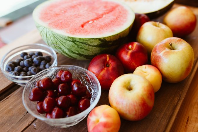 Delicious summer fruits on wooden table