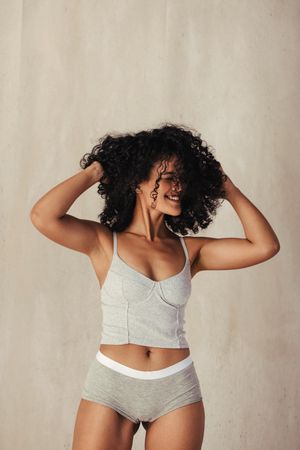 Body positive young woman celebrating her natural body in underwear