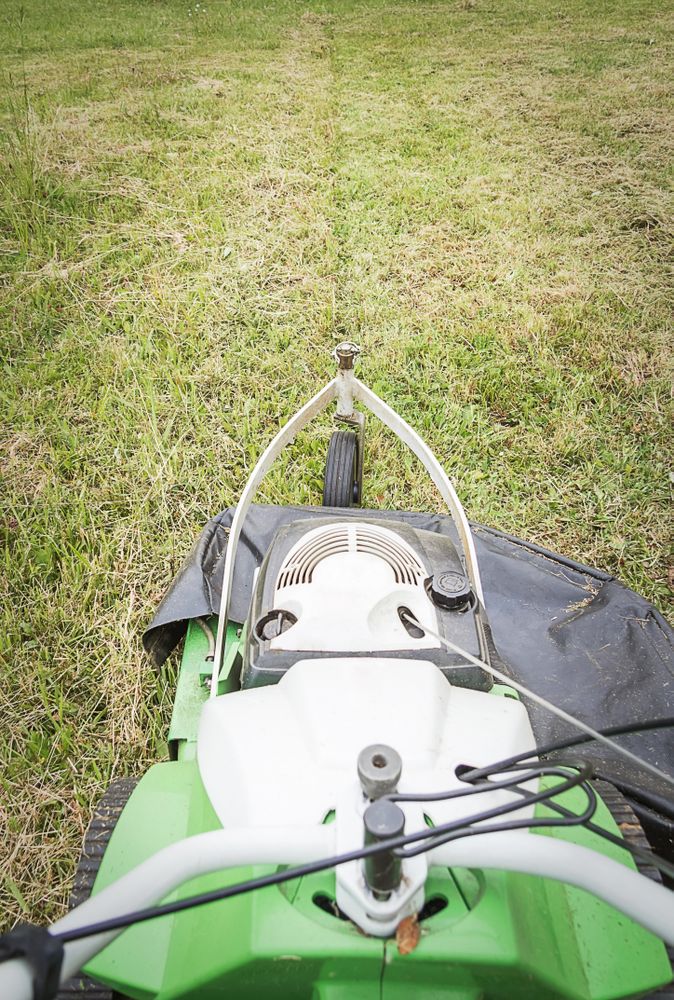 Top view of lawnmower in the garden ready to cut