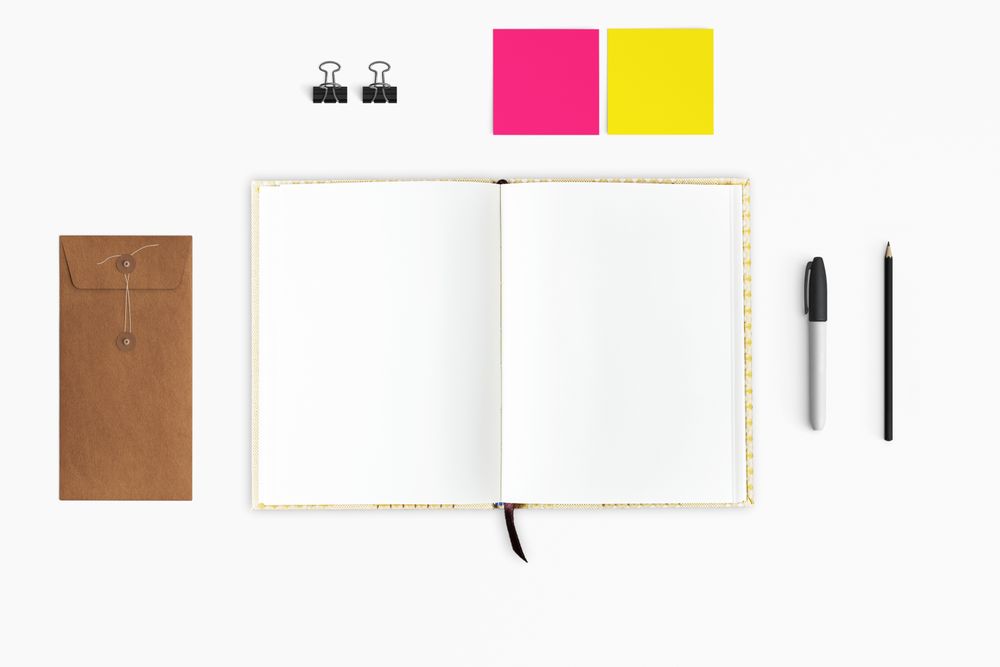 Modern workspace with coffee cup, smartphone, paper, tablet and notebook copy space