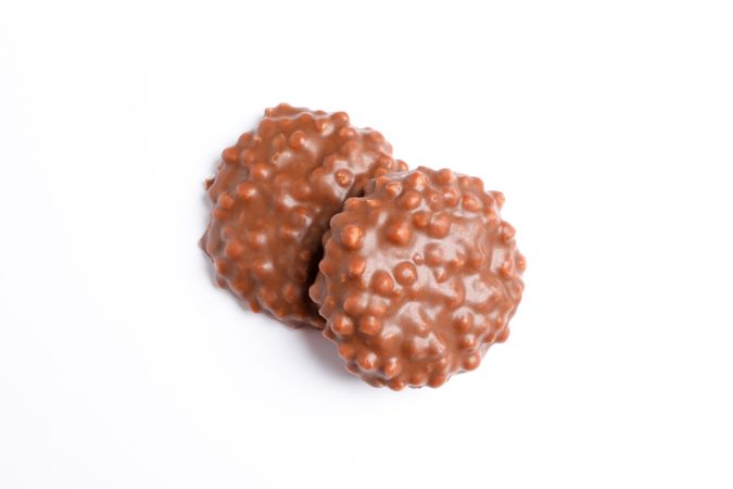 Chocolate cookies with caramel filling on blank background