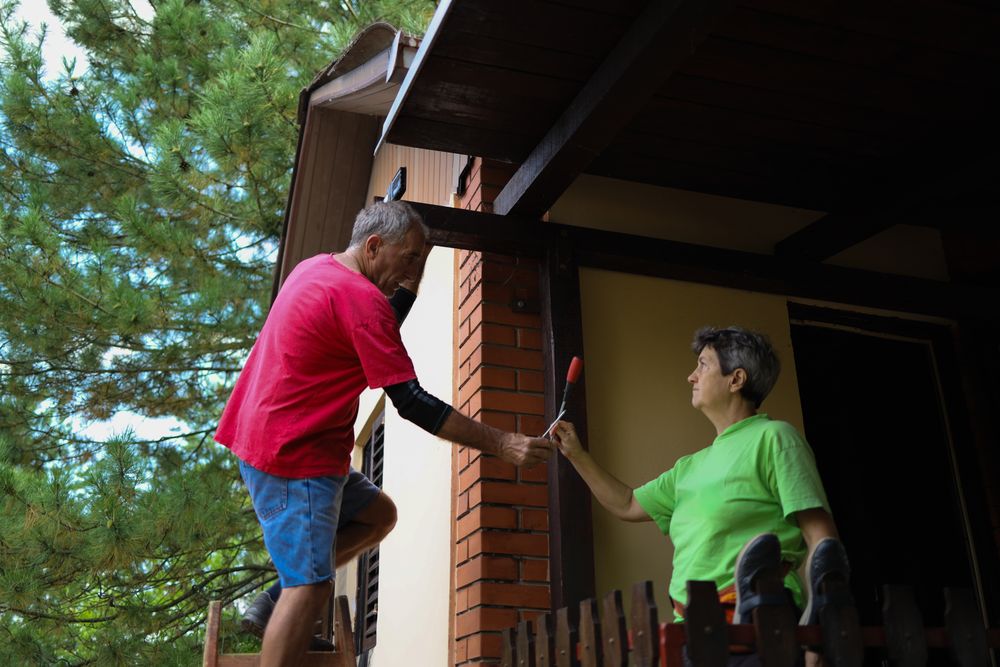 Older couple working on maintaining their home.