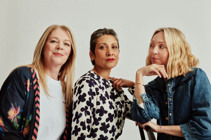 Three older fashionable women in studio portrait