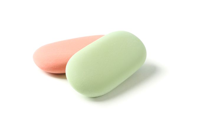 Color erasers with space for text isolated on studio background, closeup