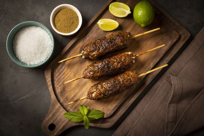 Beef kafta on the wooden board. Kafta, Traditional Arabic cuisine.