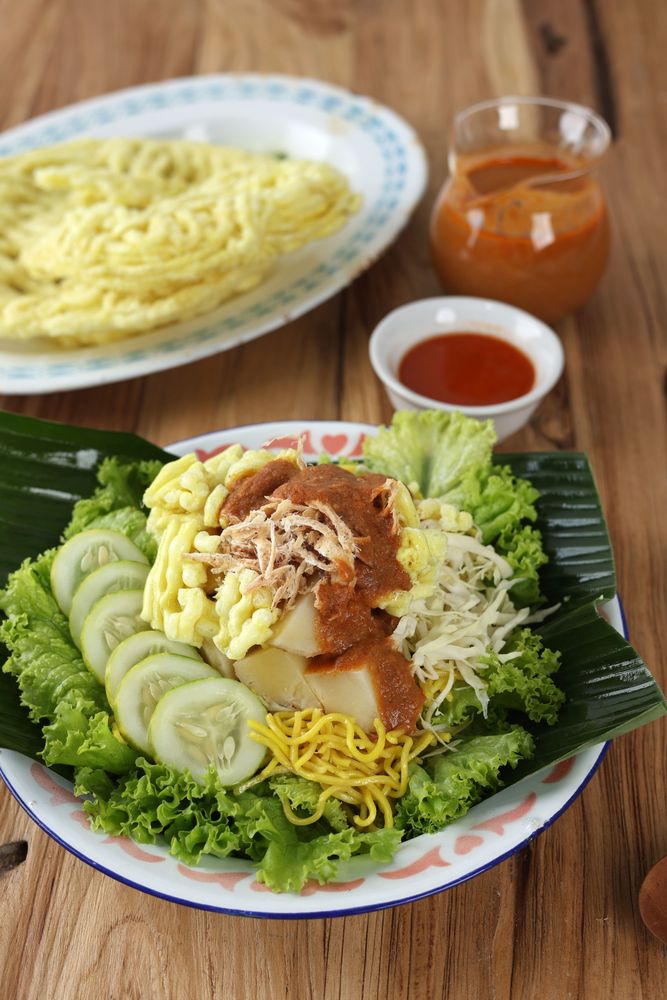 Traditional Indonesian Salad of Yellow Noodles, Vegetables, and Grilled Cuttlefish