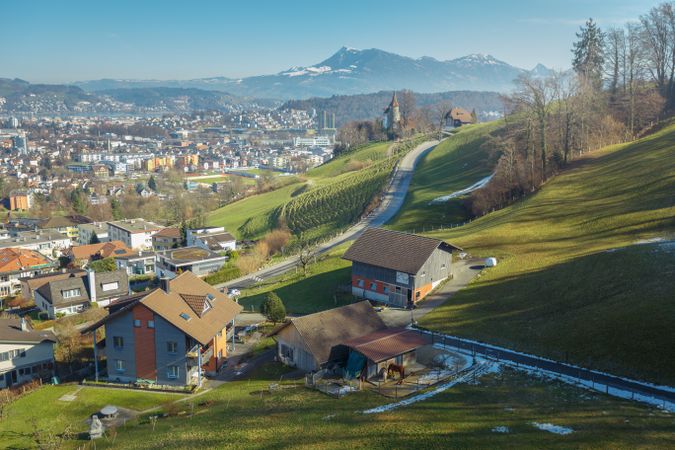 Town on green slope of mountains