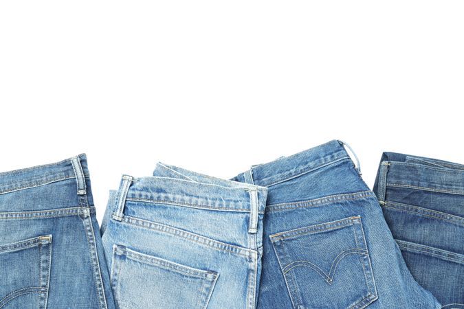 Folded jeans, isolated on light background