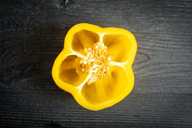 Ripe sliced pepper on gray surface