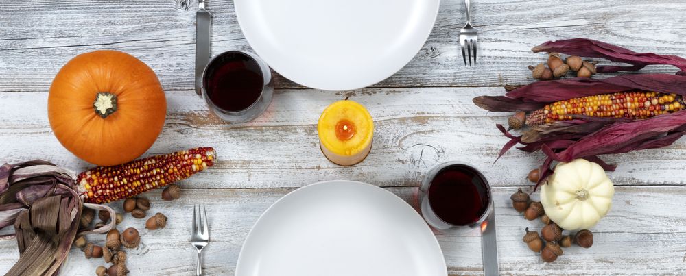 Dinner table decorated for Thanksgiving celebration