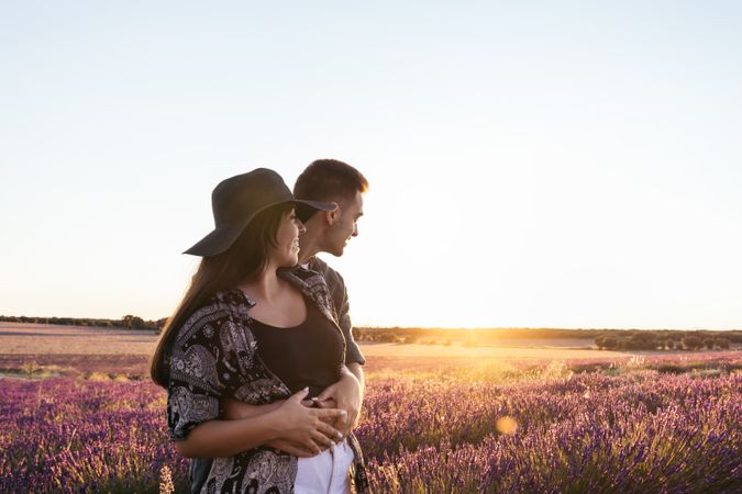 Lovely young couple in a floral field