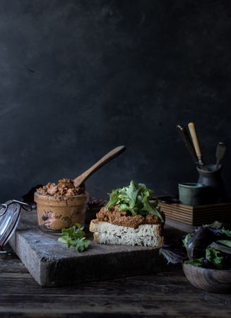 Sandwich with vegetables and dry tomatoes pate on tray