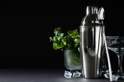 Concept of preparing cocktail, shaker, space for text