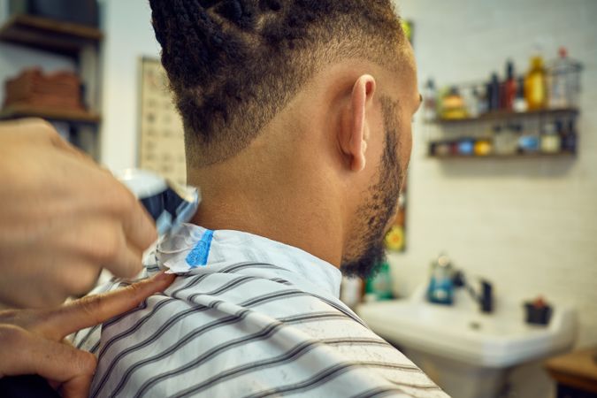 Anonymous hairstylist doing a haircut