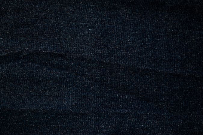Flat view Dark blue or Navy jeans fabric texture background.
