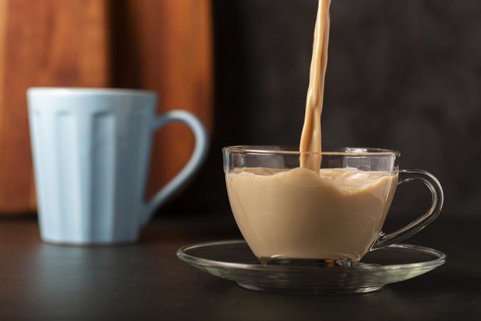 Cup of coffee with creamy milk.