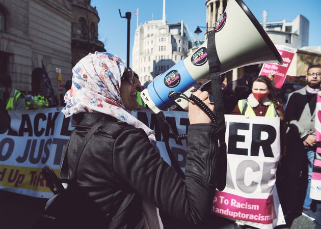 London, England, United Kingdom - March 19 2022: Islamic woman with mega phone at rally