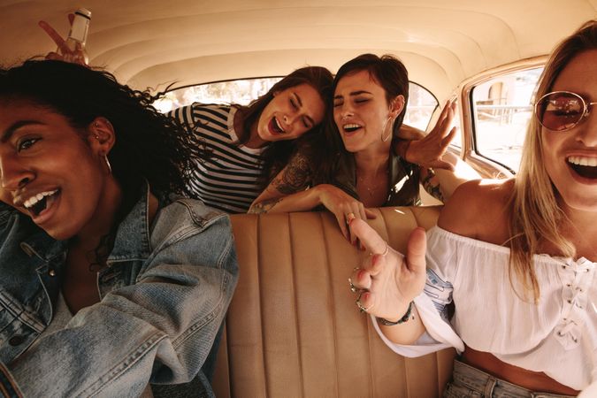 Group of women enjoying car ride