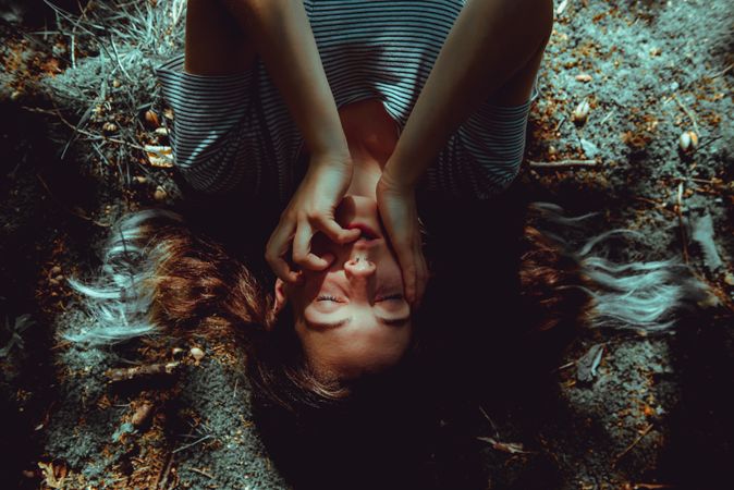 Woman lying on ground