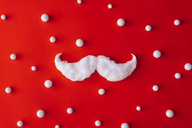 Mustache on red background with snowballs