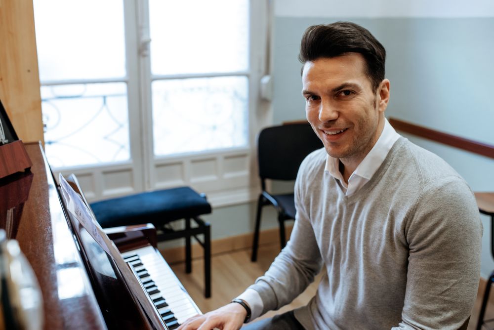 Man playing piano in studio