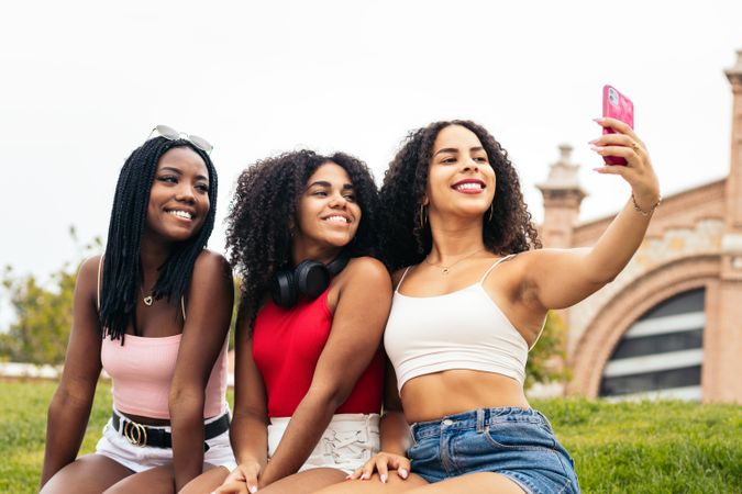 Young Happy Friends Enjoying Summer Together and taking selfies