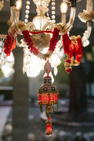 Chandelier with red pendant ornament