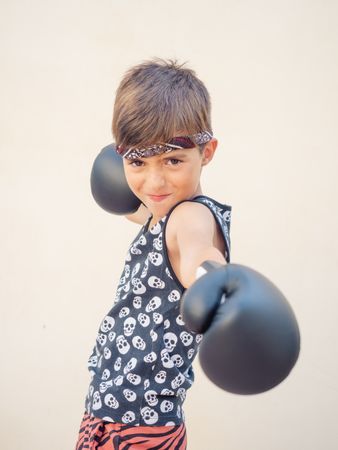 Sporty boy with boxing gloves