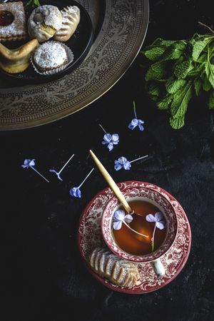 Traditional tea with mint and assorted Arab sweets