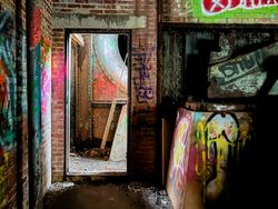Room with heavy grafitti