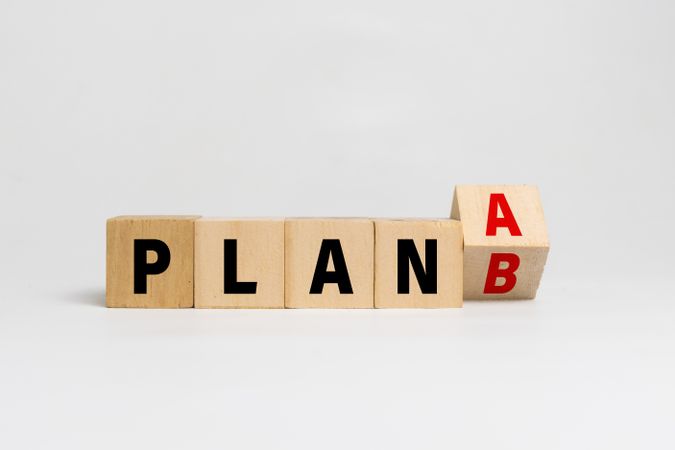 flip wooden blocks with plan a or b
