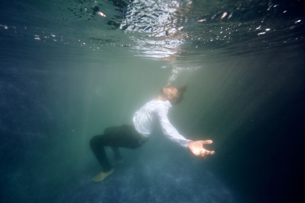 Lonely man drowsing in pool