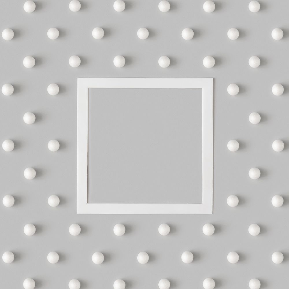 Holiday pattern with snowballs with blank center on gray background