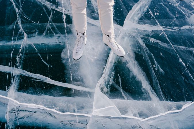 Woman skating on frozen river