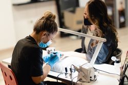 Woman getting a manicure at the beauty salon