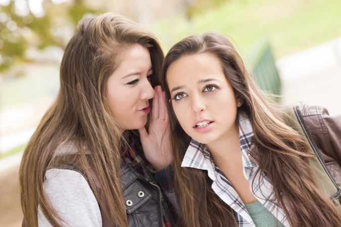 Women Whispering Secrets Outside